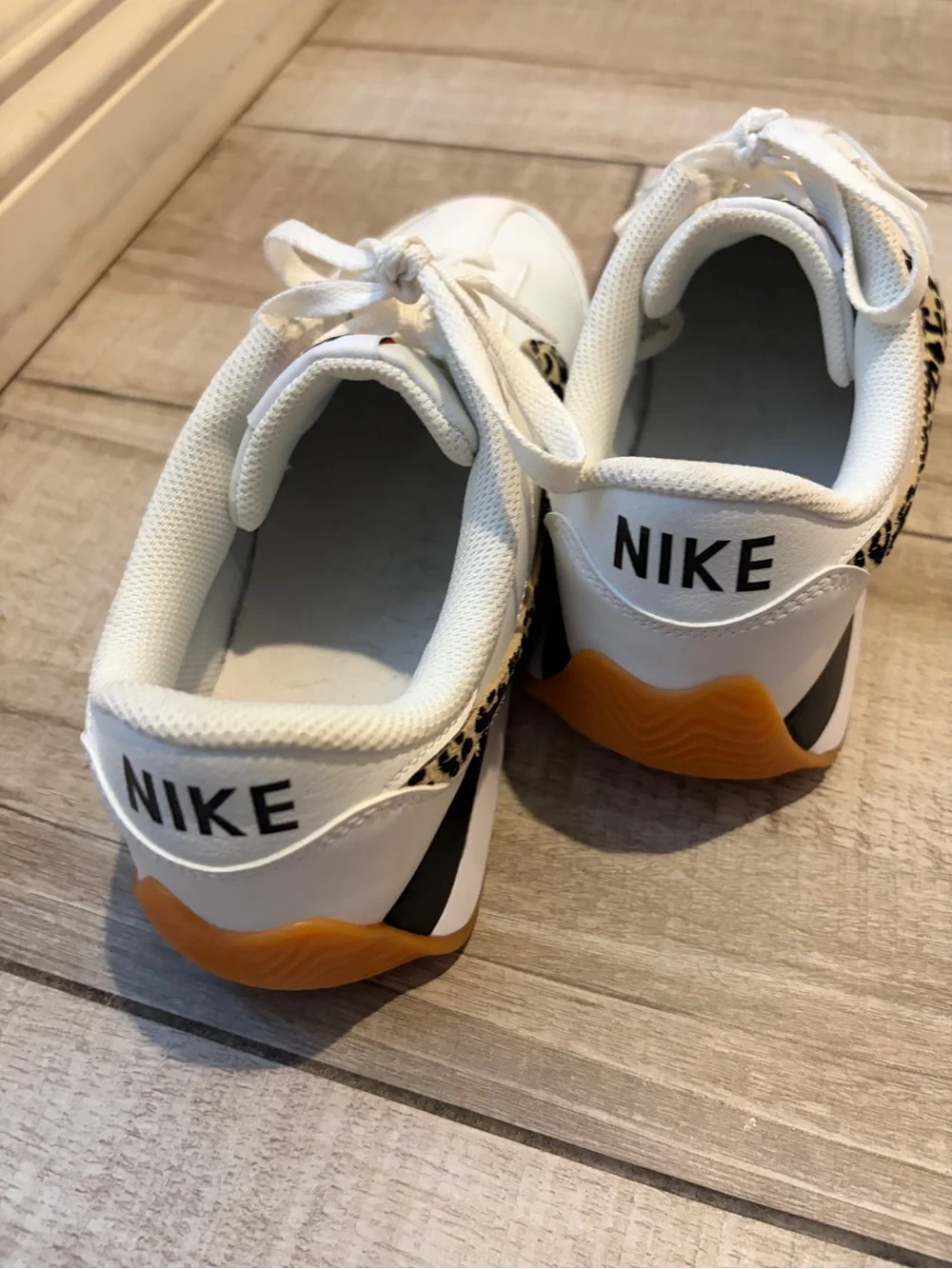 Nike Women's White Sneakers with Leopard Swoosh and Orange Heel Tab